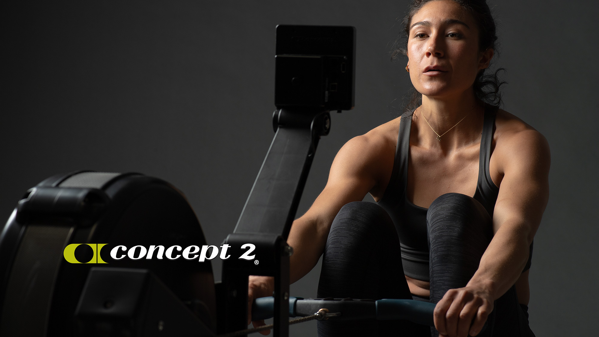 Female athlete rowing on Concept2 Row Erg at Rowed to Fitness, in Bend Oregon